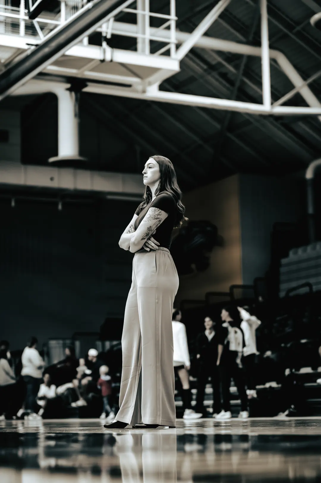 Volleyball player watching the court from the sideline
