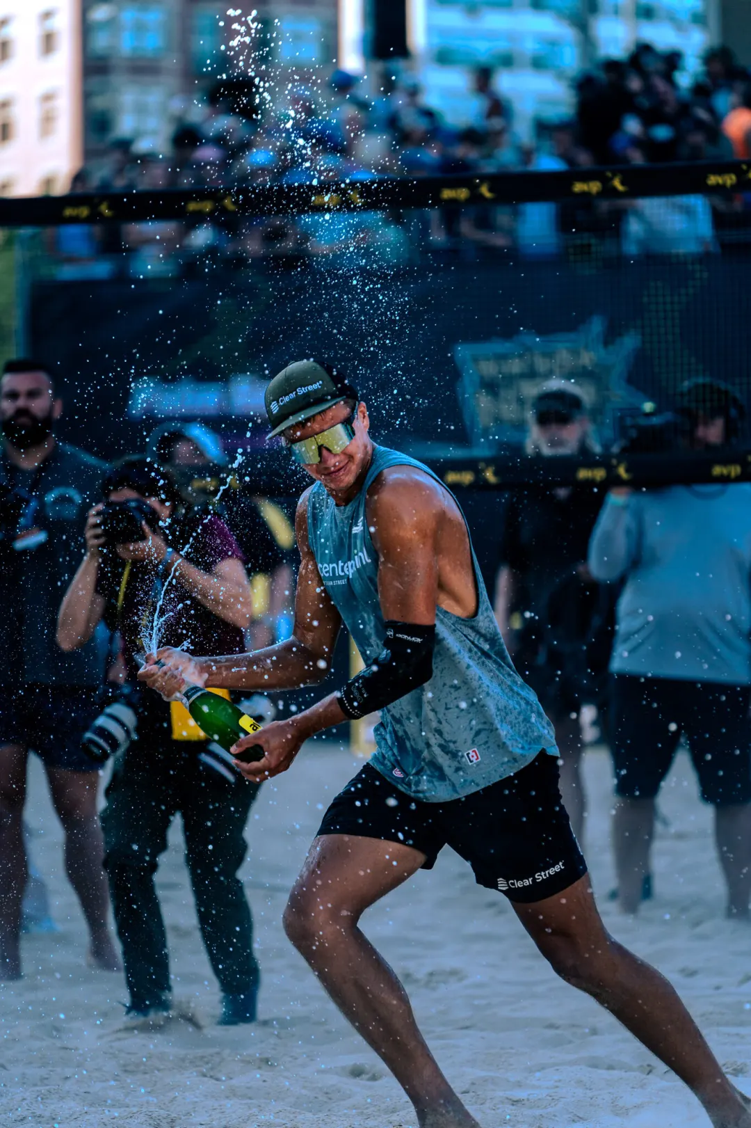 Beach volleyball player competing in wet conditions