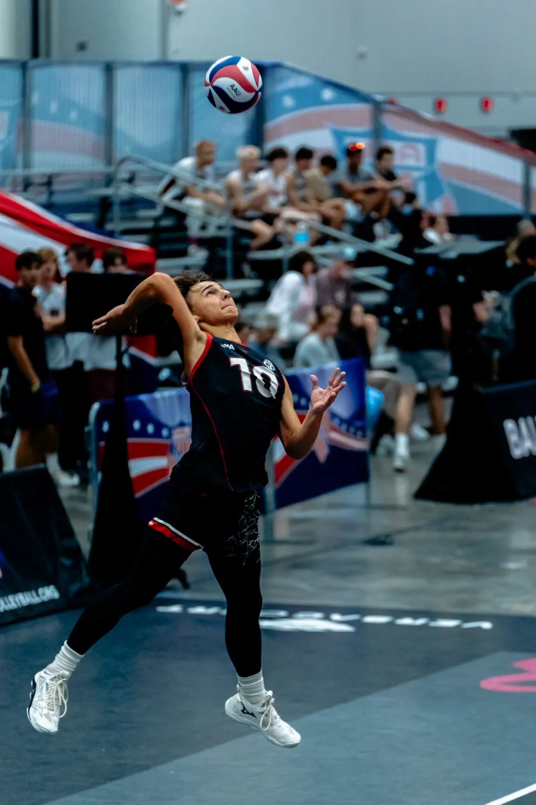 Volleyball player diving to keep the ball in play