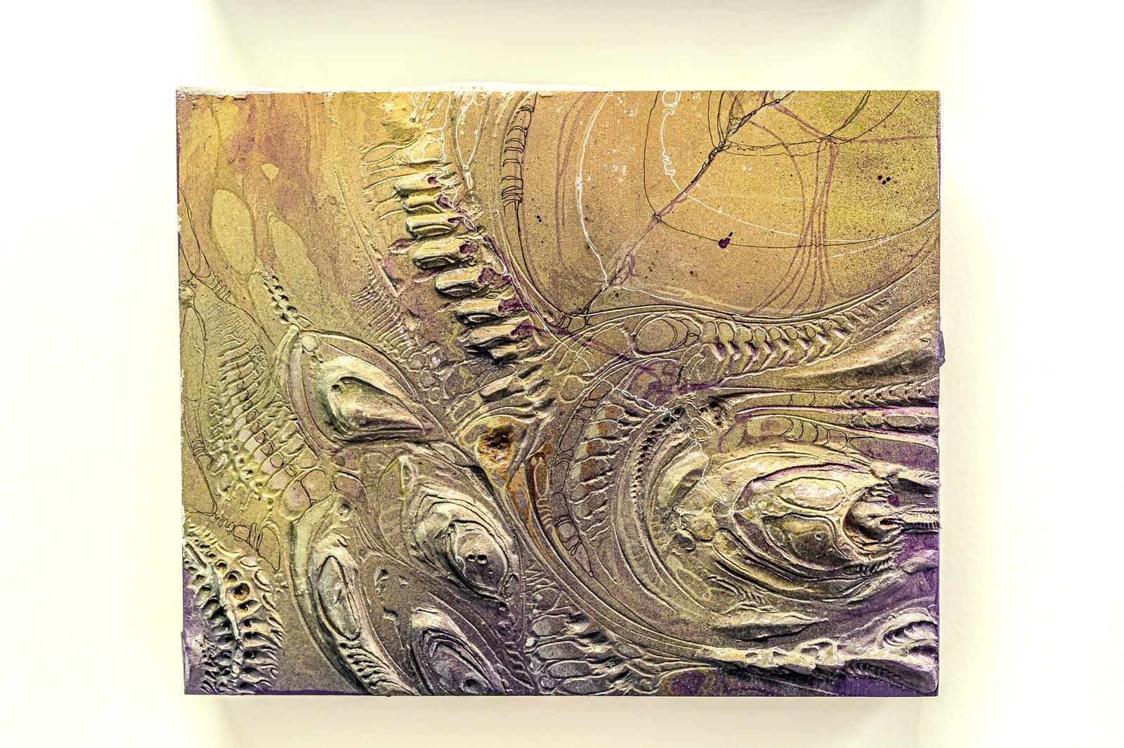 A textured artwork with metallic and purple hues features curved lines and ridges.