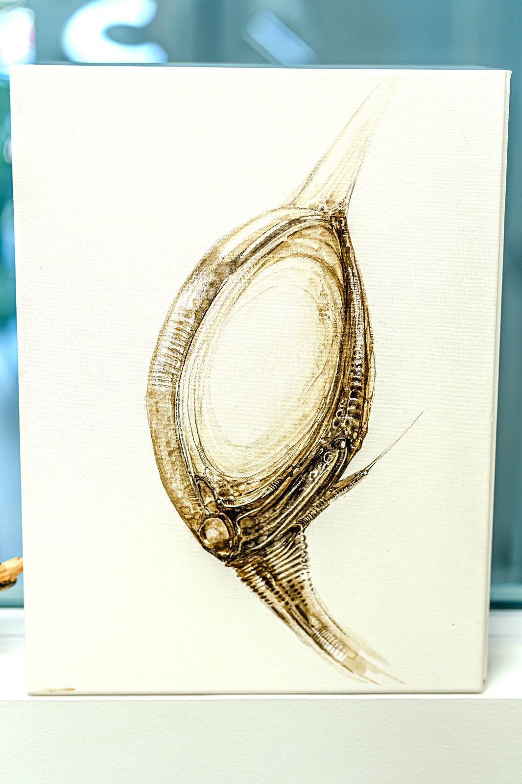 A drawing of a biomechanical creature on canvas.
