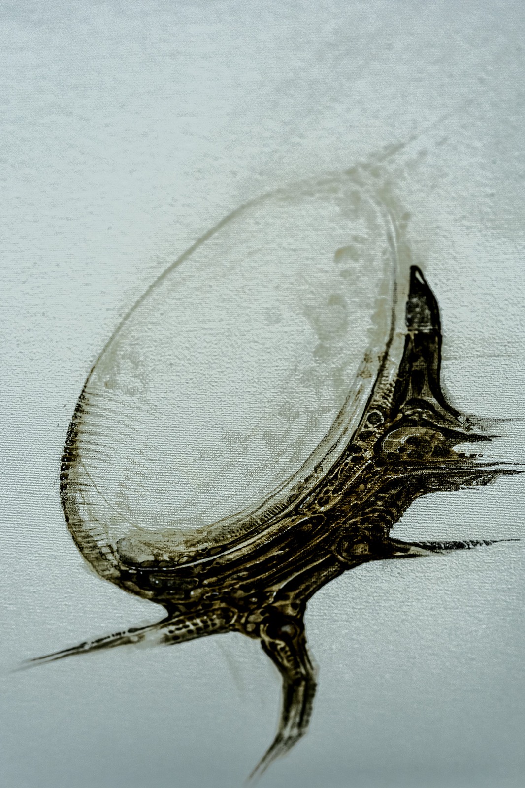 Abstract painting of a textured oval shape with dark, organic lines.