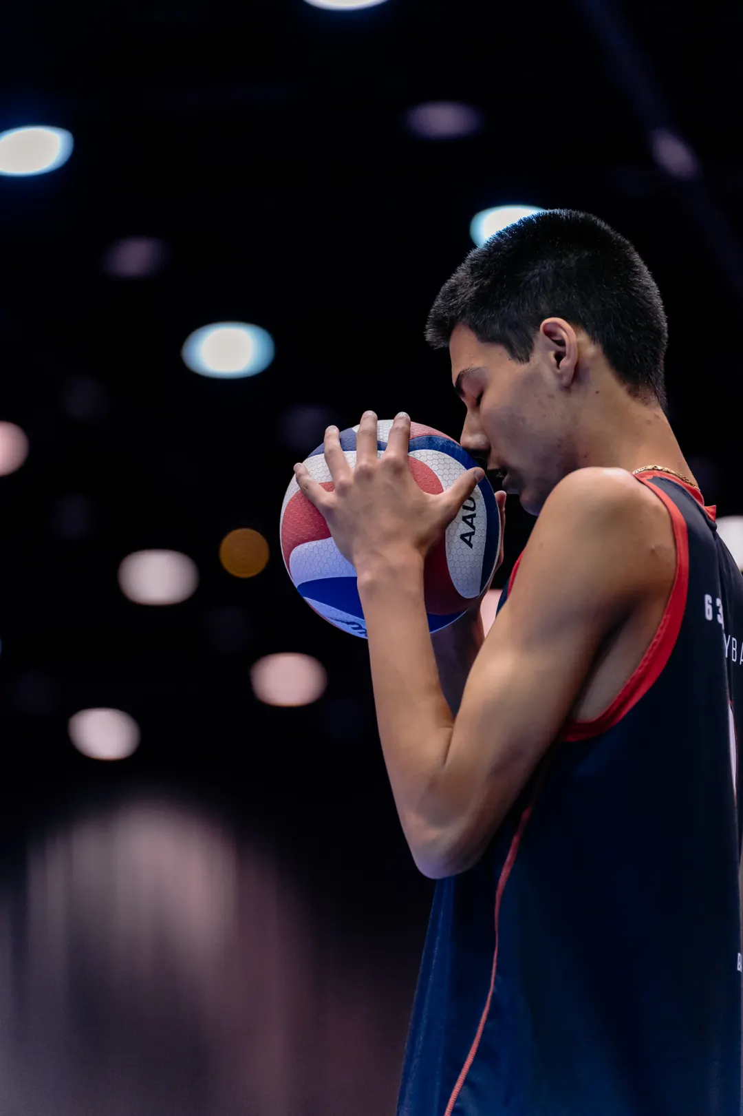 Volleyball player holding a ball before play